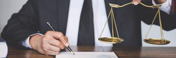 judge-gavel-with-justice-lawyers-lawyer-or-counselor-working-on-a-documents-and-holding-balance-in_t20_B8OlWO